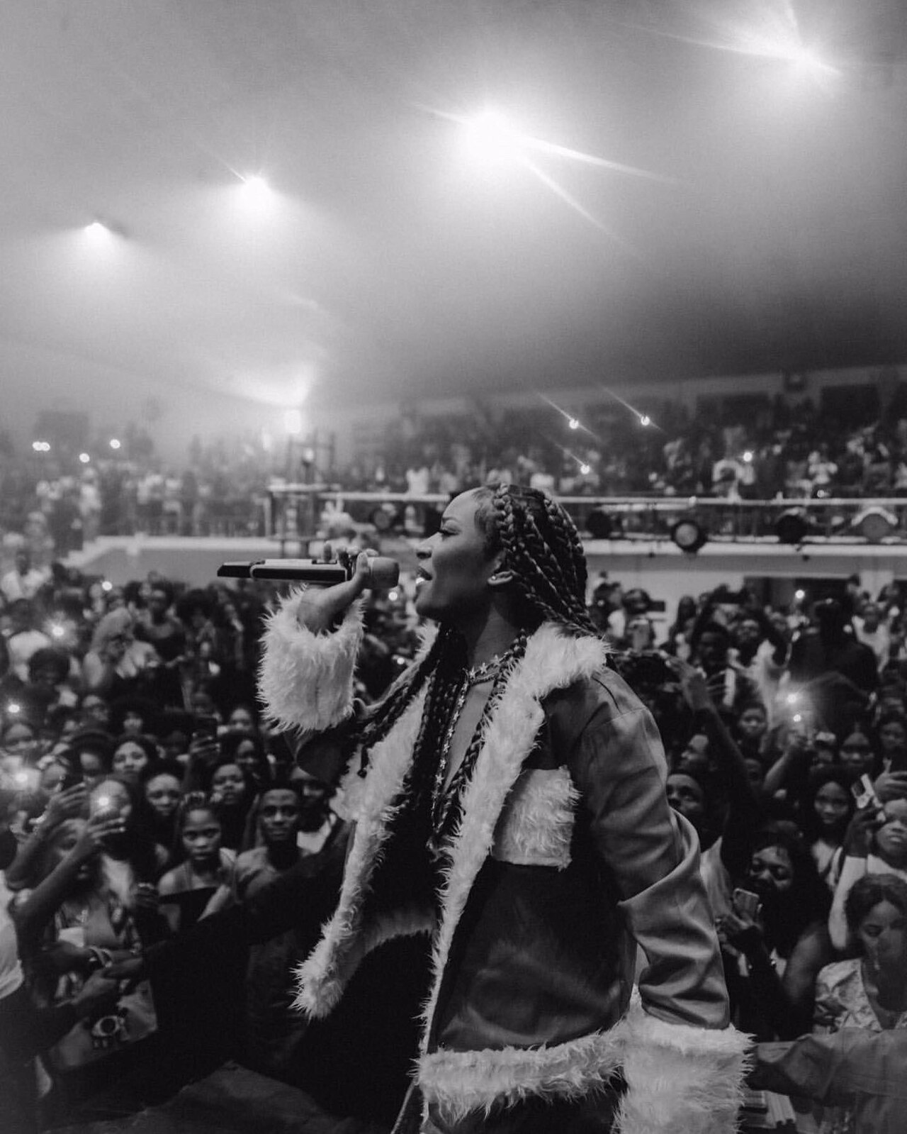 Ayra Starr performing on stage at the Miss Uniben pageant in 2021