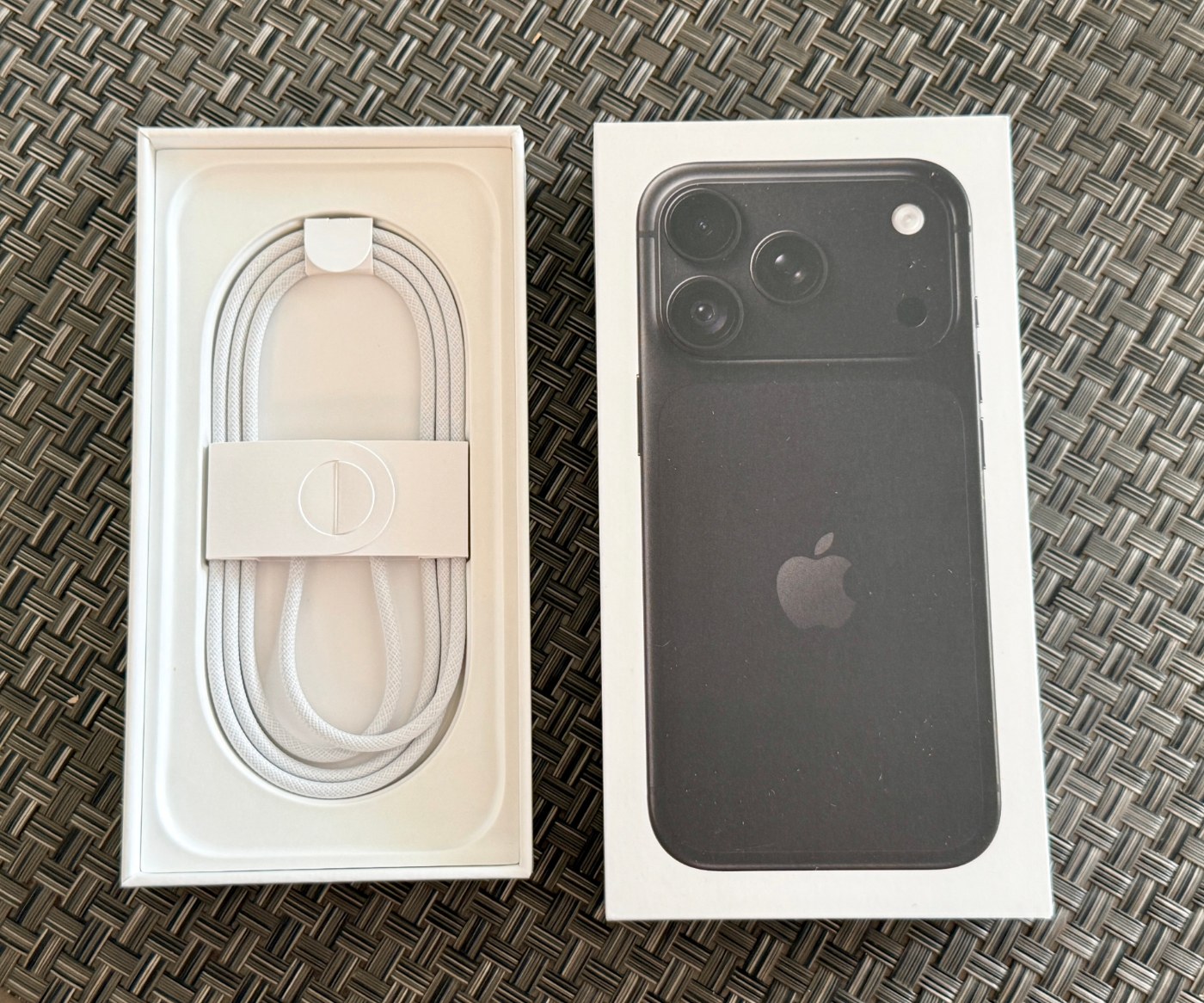 A black iPhone 18 Pro in its box