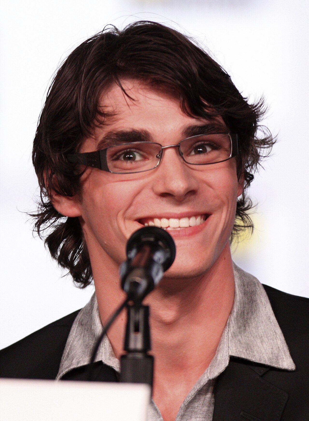 RJ Mitte smiling at a Breaking Bad panel at San Diego Comic-Con in July 2012
