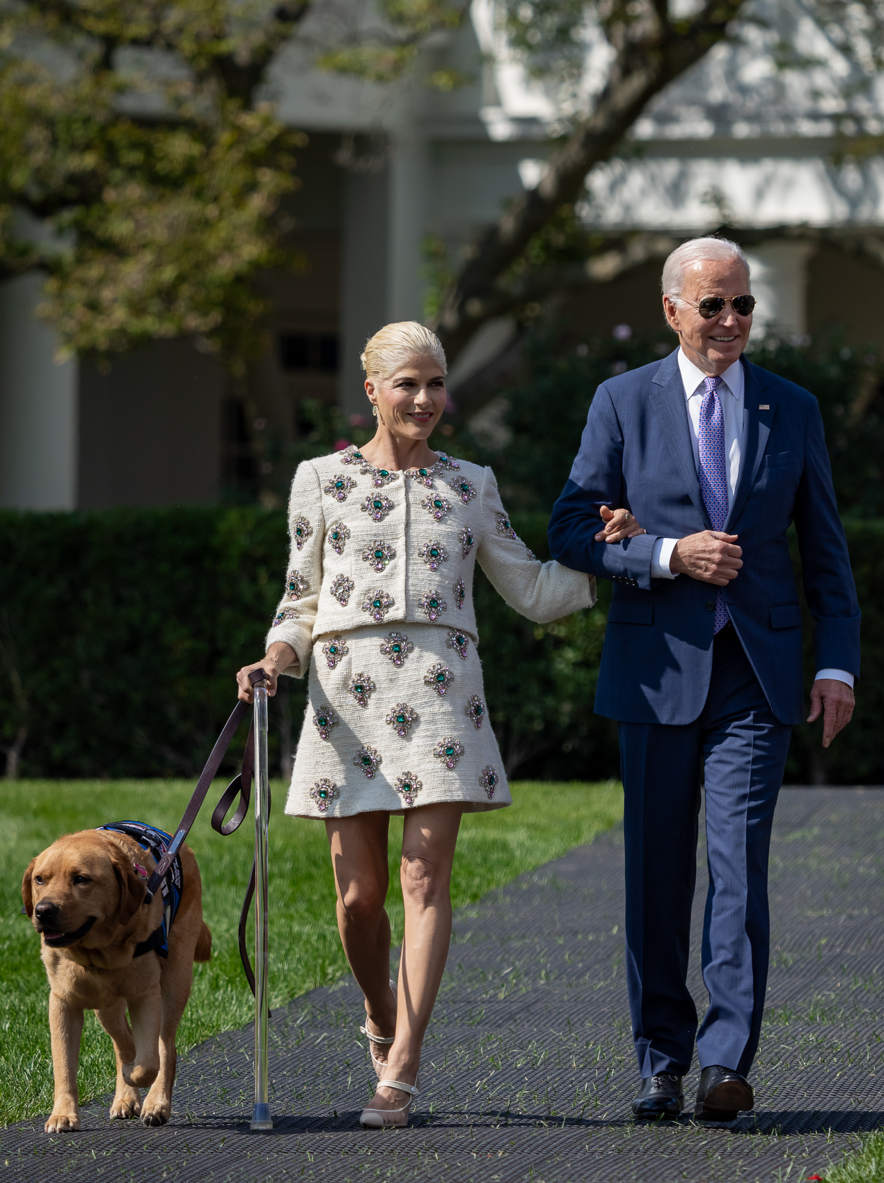 Selma Blair walks with President Joe Biden to the ADA reception at the White House on 2 October 2023