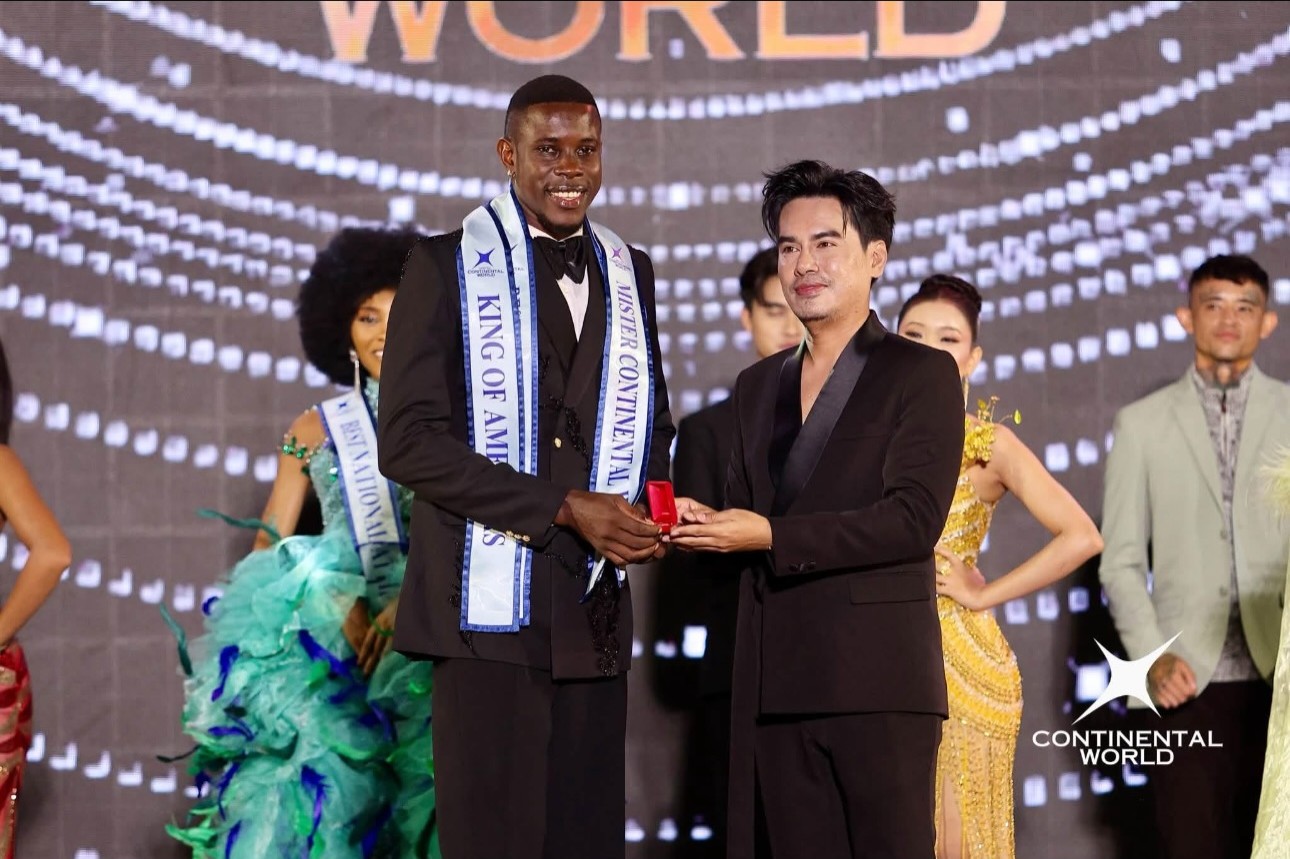 Unwana Essien receiving an award on stage at Mister Continental World 2026